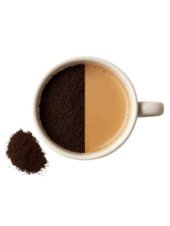 brewed Assam Gold tea in a cup and tea powder is scattered around the cup